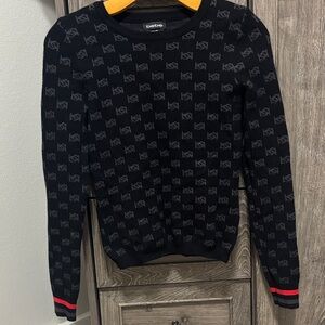 Bebe Black Knit Sweater with Red Trim Cuffs